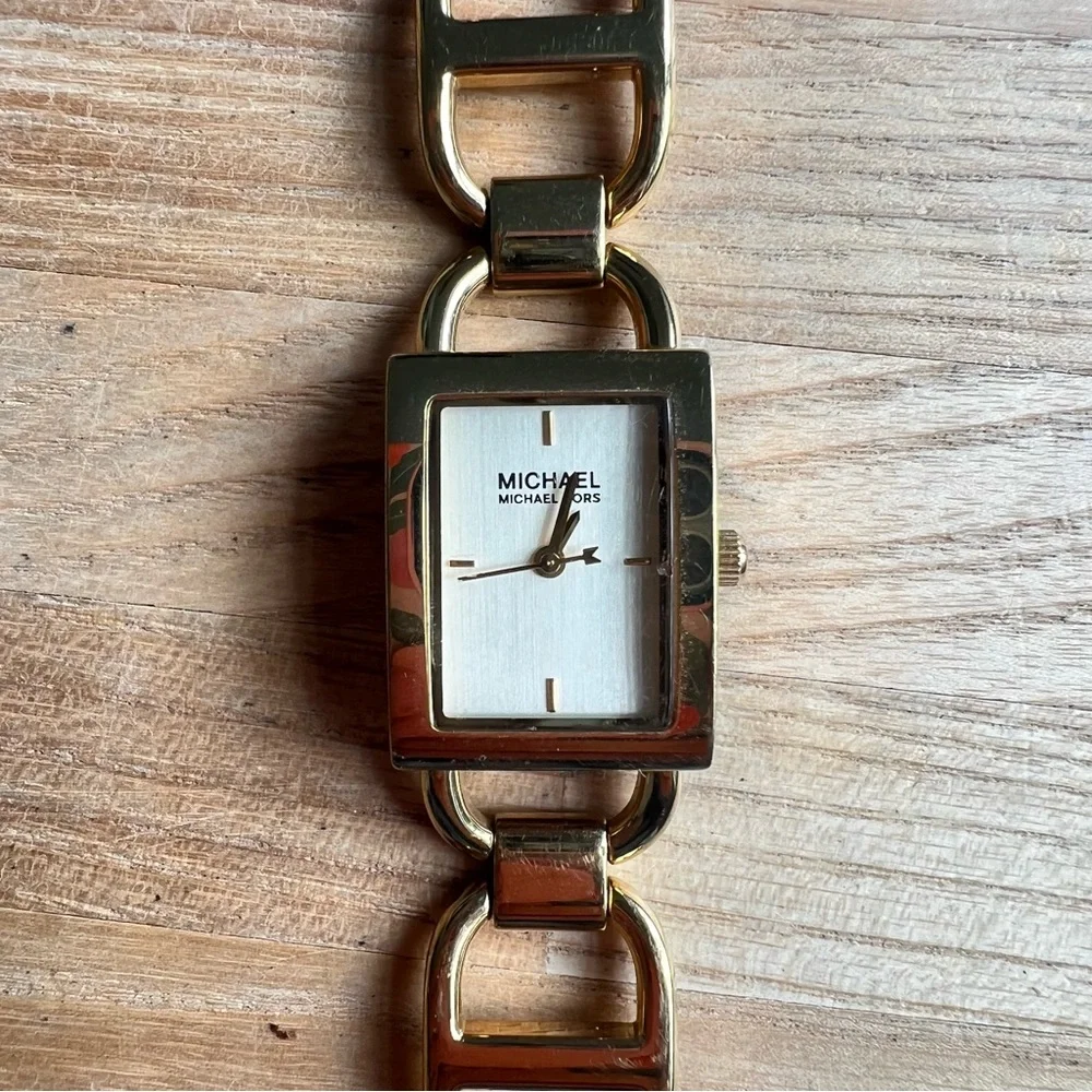 Michael Kors ladies rectangular gold tone bracelet dress watch NEW BATTERY